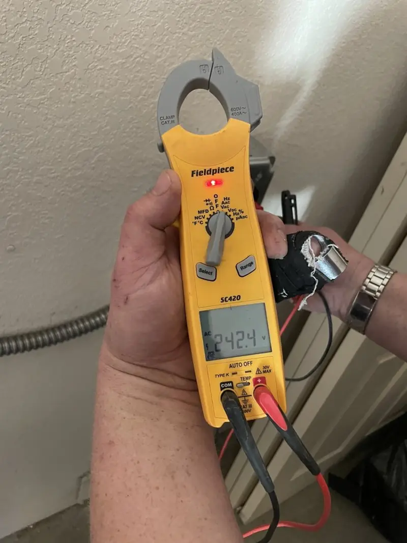 Voltage testing with clamp meter during Outlet Installation in Algonquin